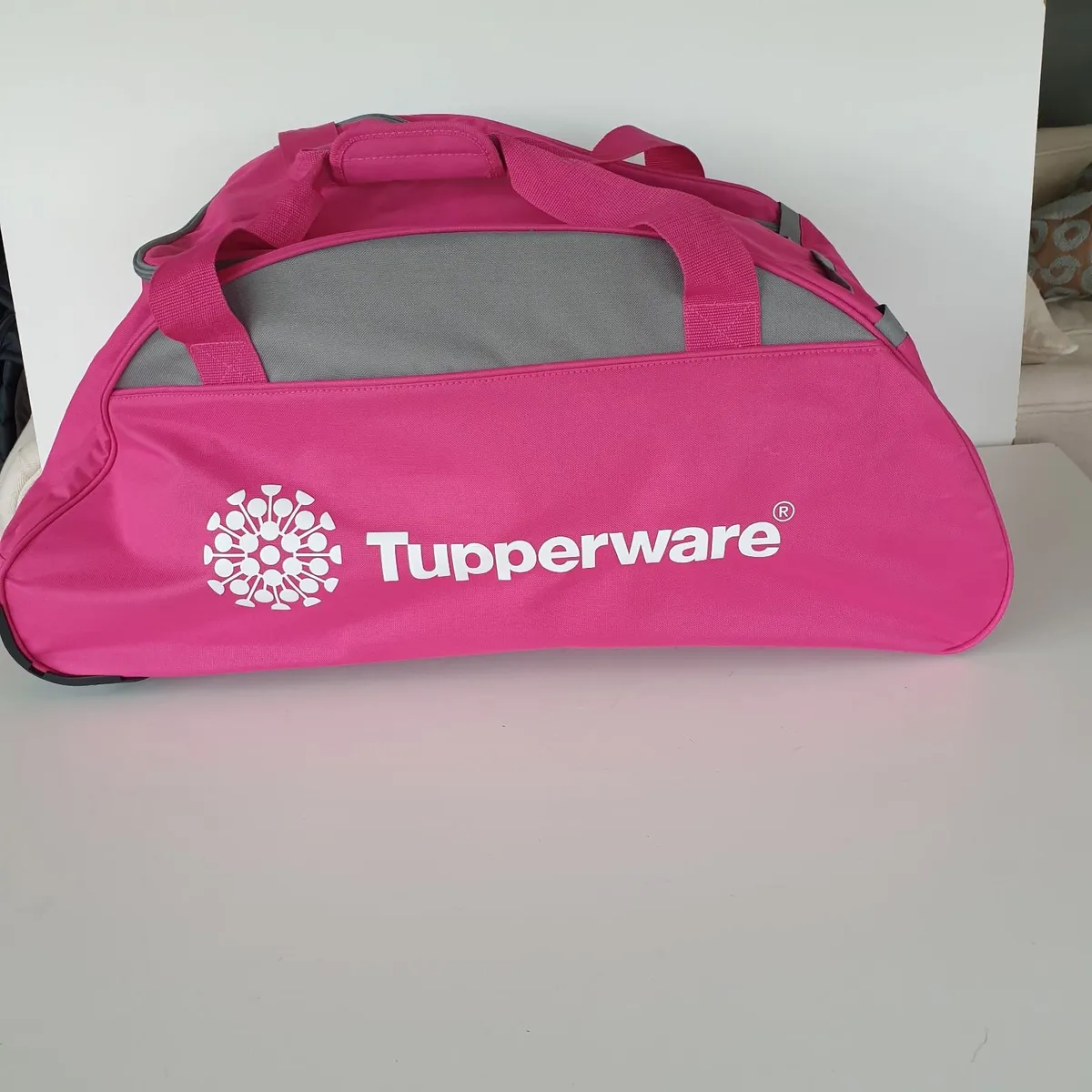 Tupperware pink roller bag - Image 1