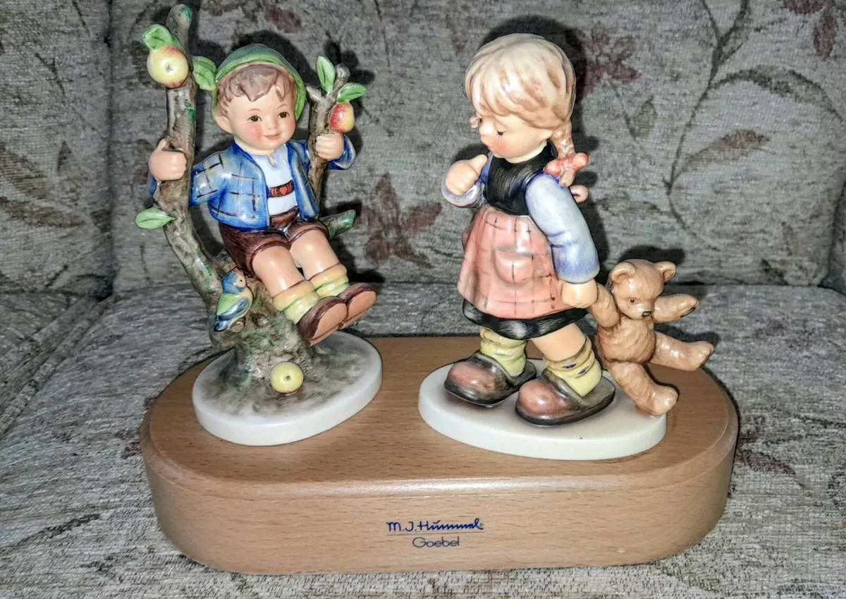Two Hummel figurines on wooden stand - Image 1