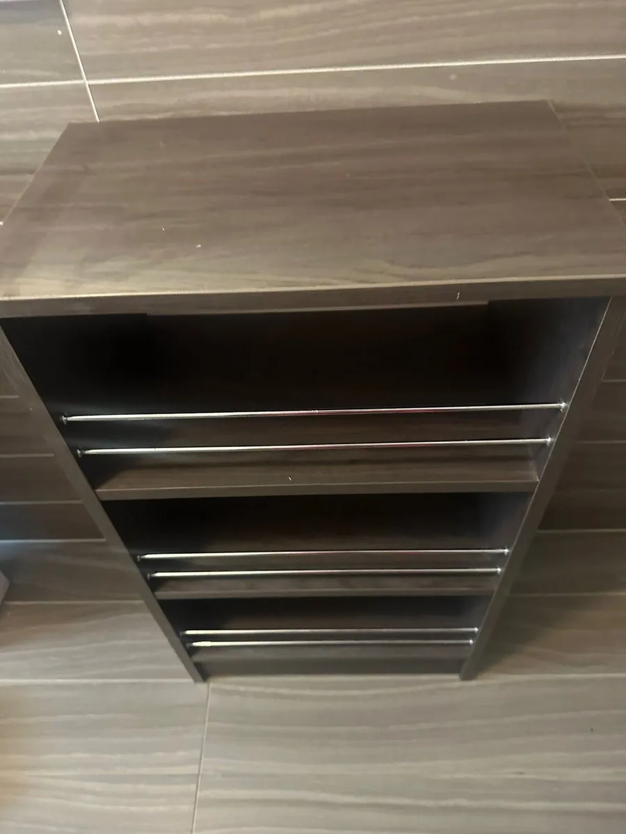 Dark wood storage unit with metal rails - Image 4