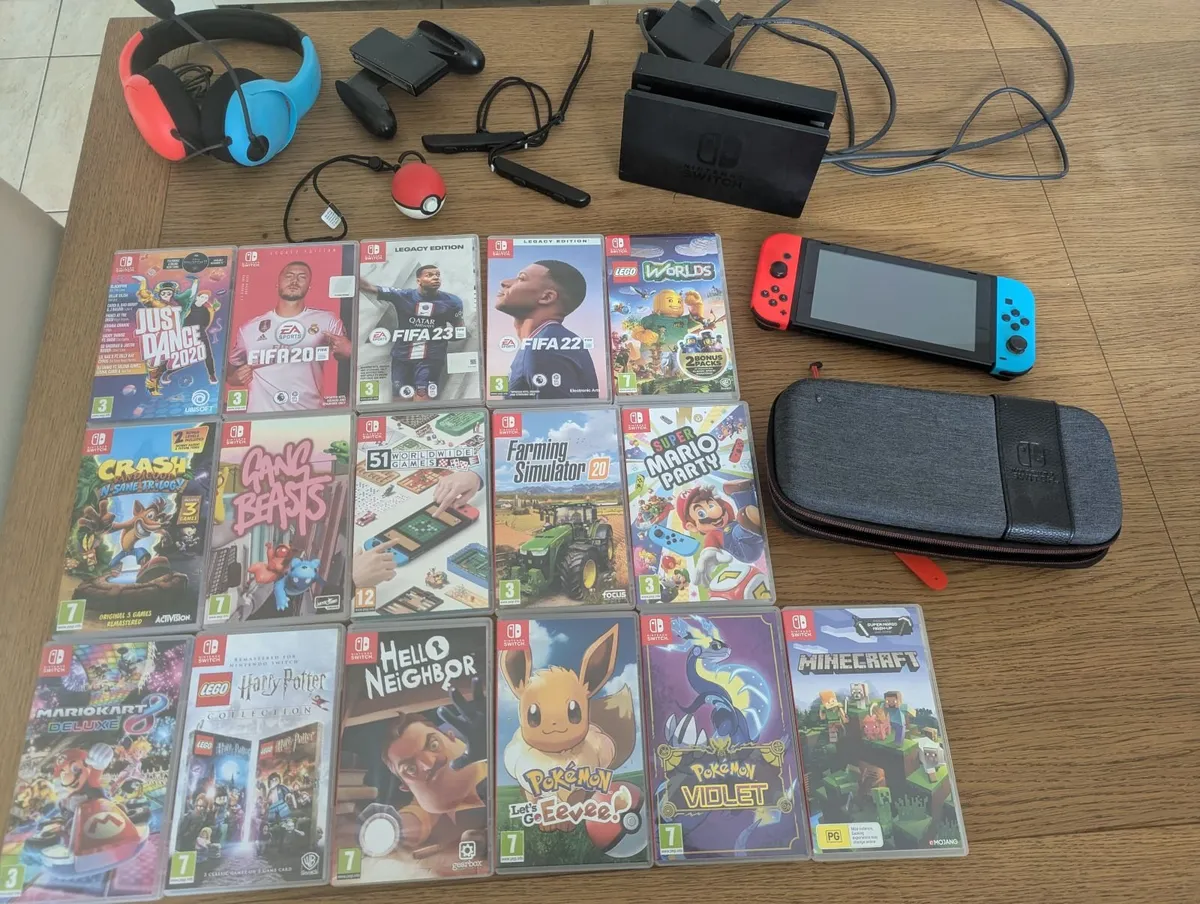 Nintendo switch with 16 games and accessories - Image 1