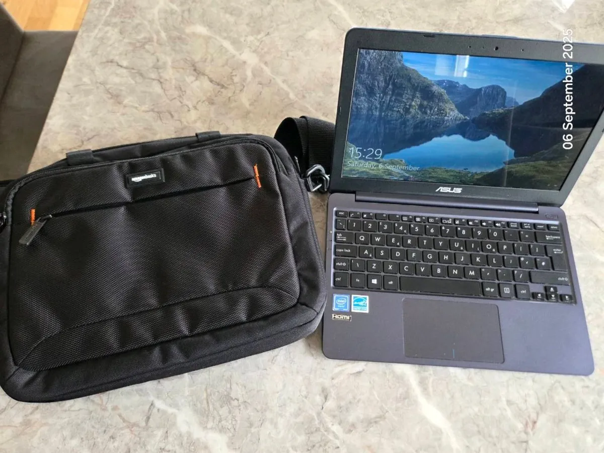 Asus laptop and case - Image 1
