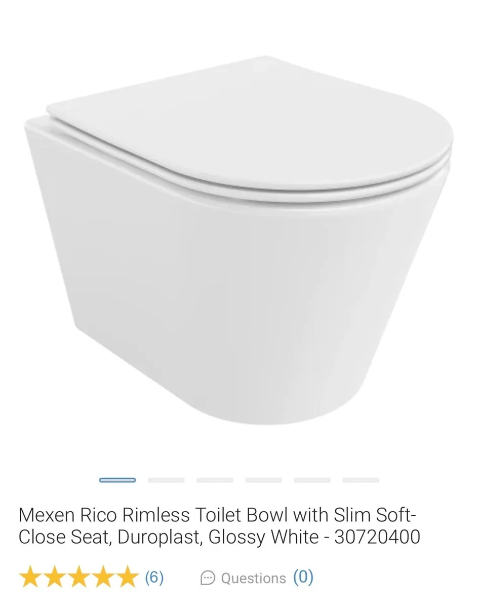Wall mounted toilet with gold flush buttons - Image 1
