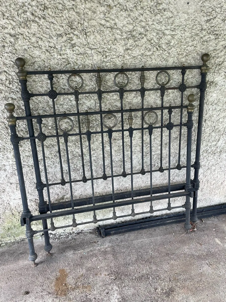 Antique iron bed with brass detail. - Image 1
