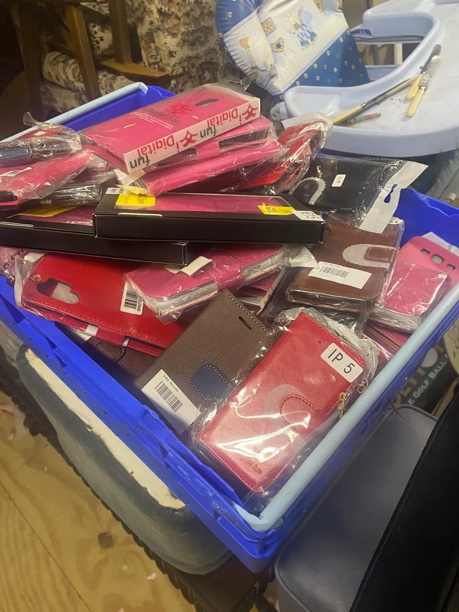 Crate of phone cases - Image 1