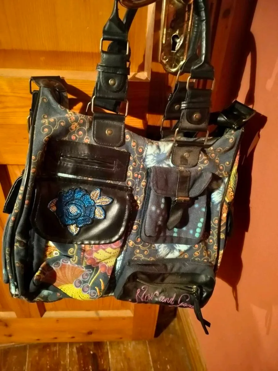 This colorful patchwork shoulder bag is from the b - Image 1