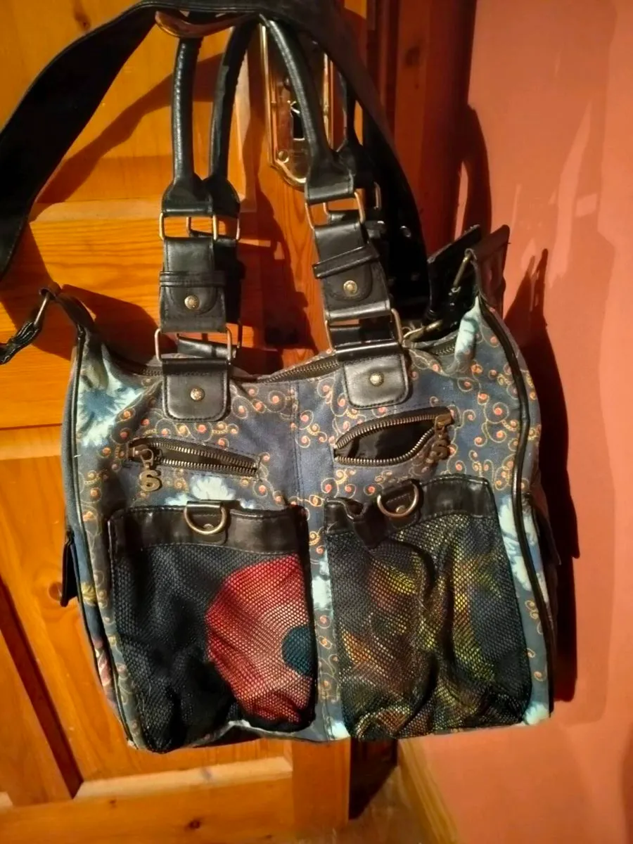 This colorful patchwork shoulder bag is from the b - Image 2