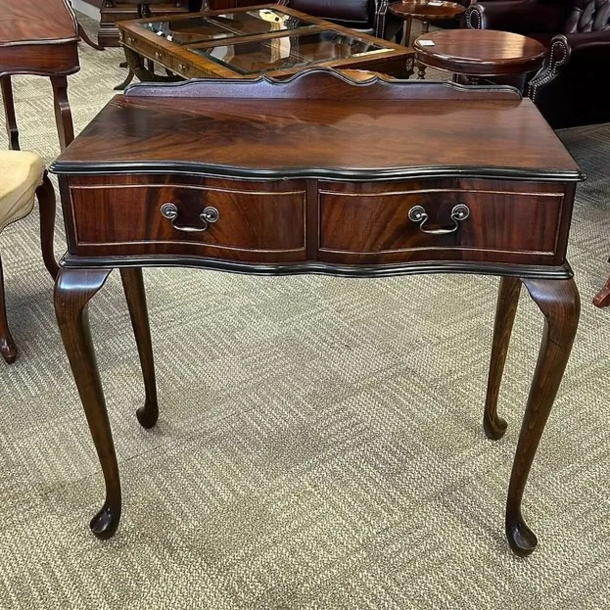 Beautiful mahogany curve fronted console table wit