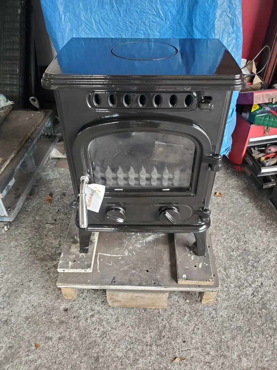 New Black Enamel Firewarm 4.2 kw solid fuel. - Image 1