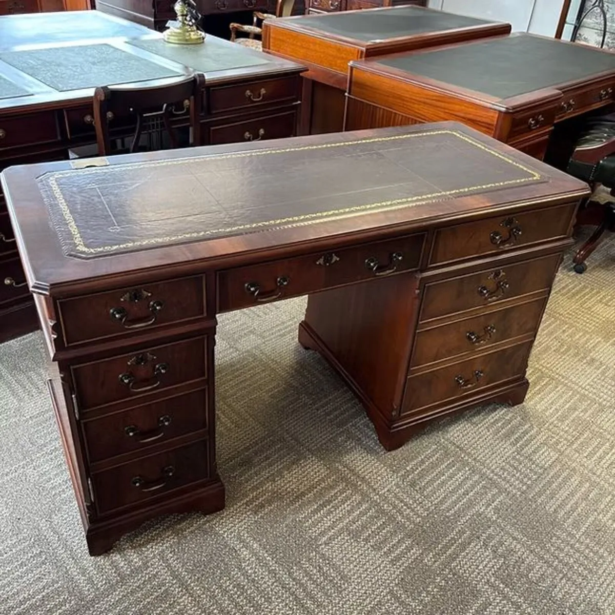 Mahogany flamed red leather top twin pedestal comp
