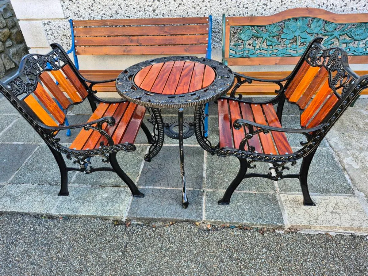 Cast iron table and chairs - Image 1