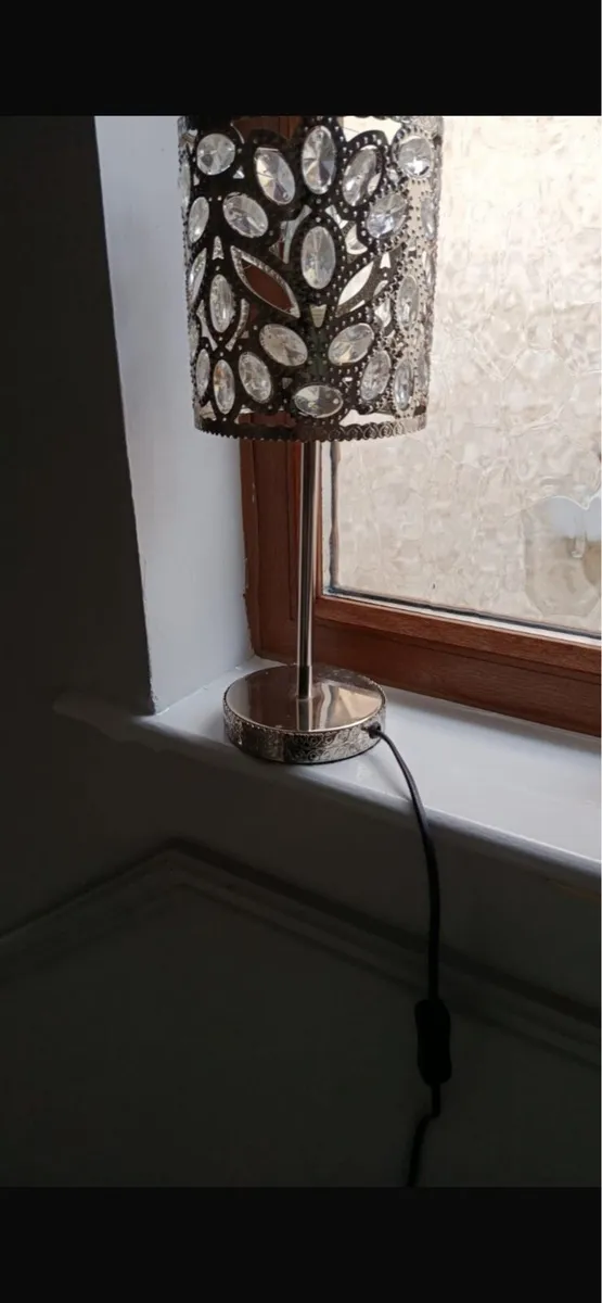 Two silver table lamps