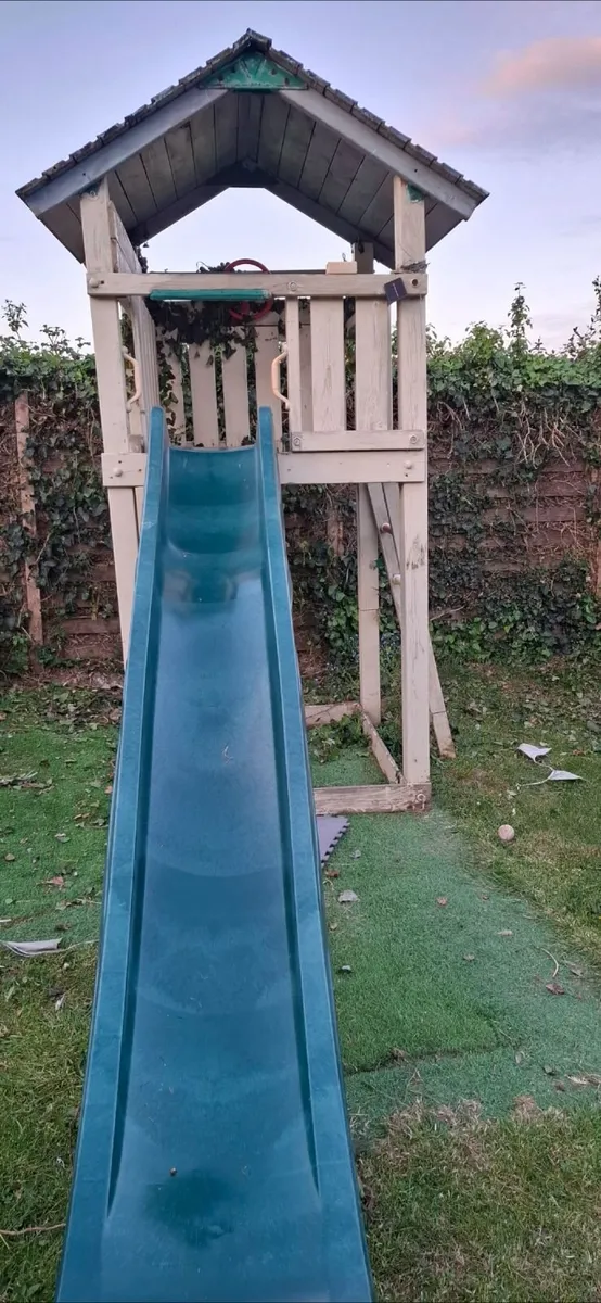 Wooden treehouse and slide - Image 1