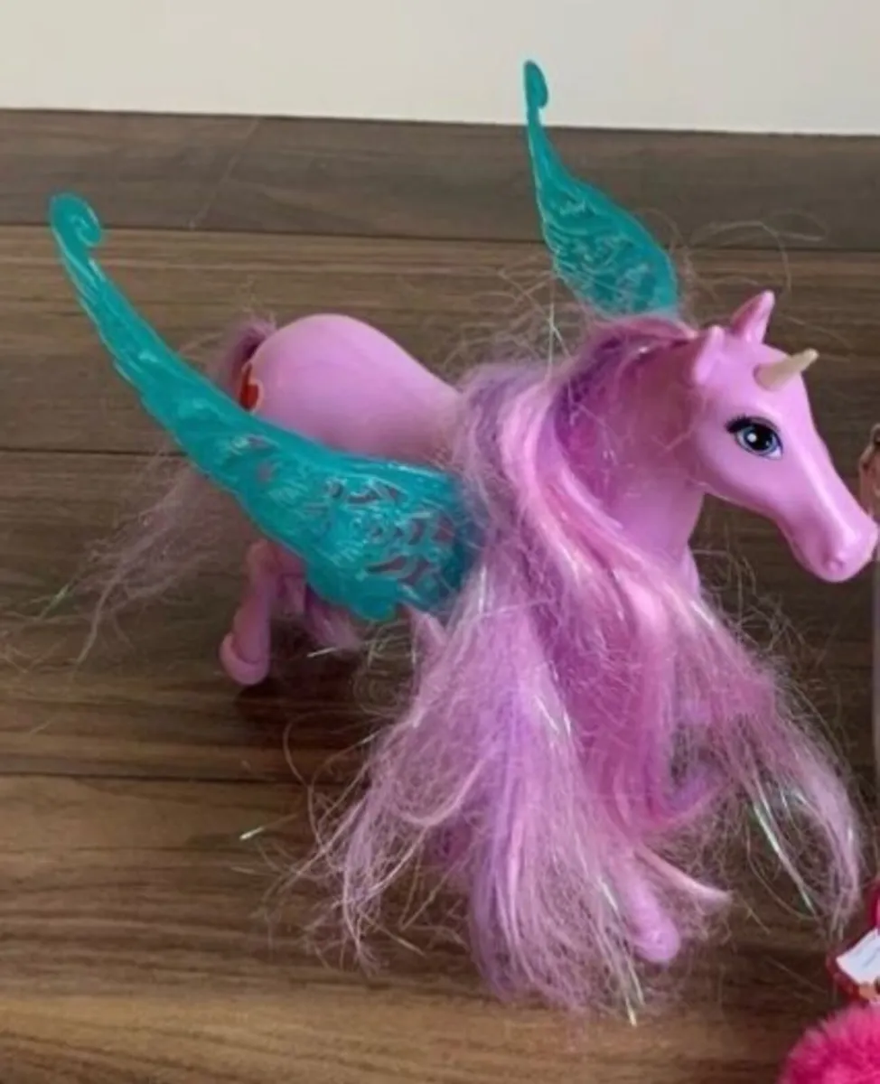Barbie A Touch of Magic Pegasus toy featuring a pi