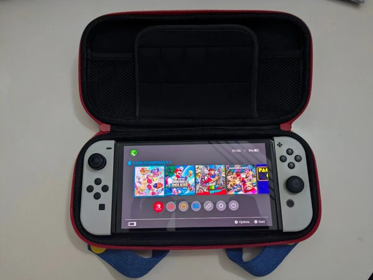 Nintendo Switch OLED + Case - Image 1