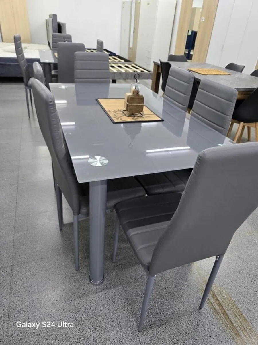 Modern Glass Dining Table With 6 Leather Chairs - Image 1