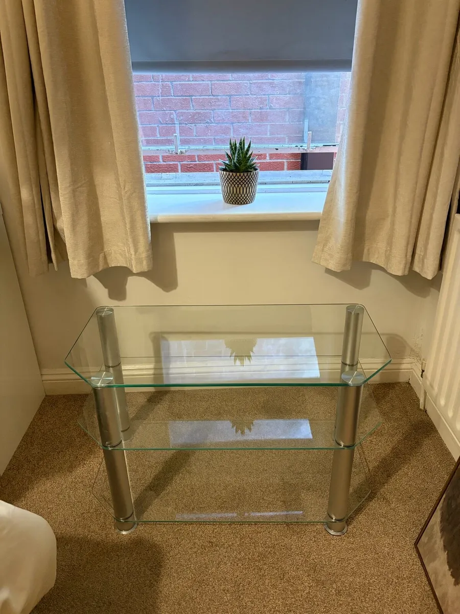 Glass TV stand with chrome legs - Image 2