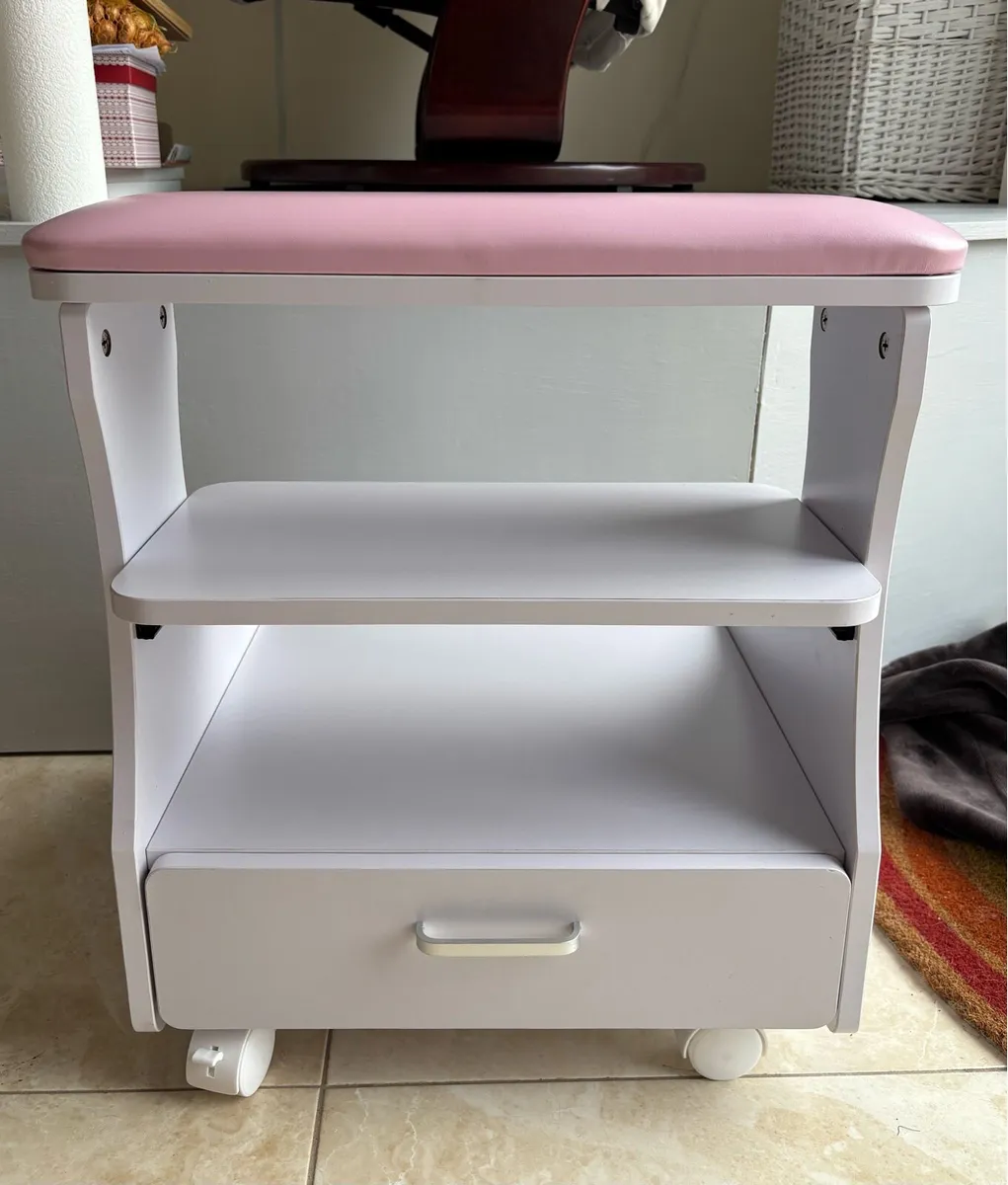 Pink pedicure foot rest on wheels - Image 1