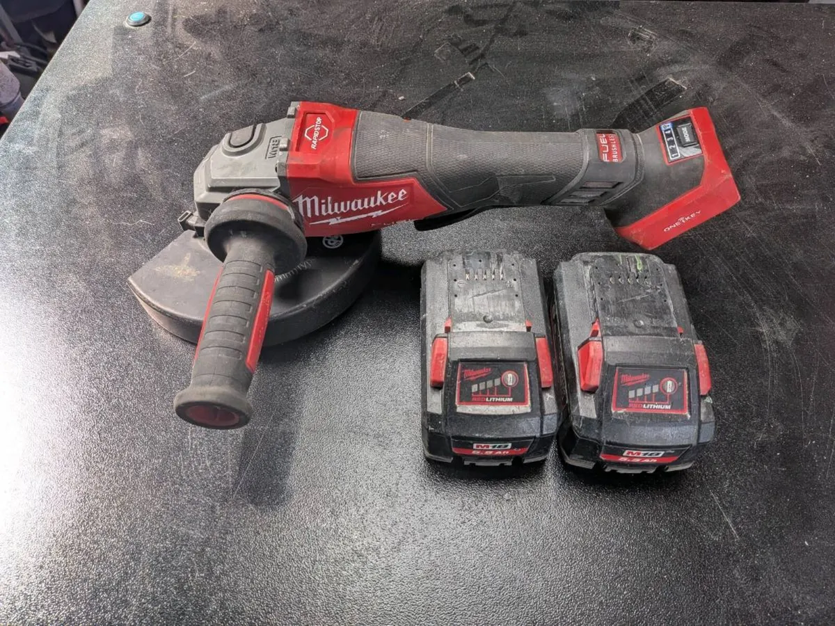 Milwaukee 7" (180mm) grinder plus batteries - Image 1