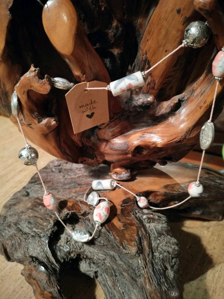 This handmade necklace features a combination of c - Image 4