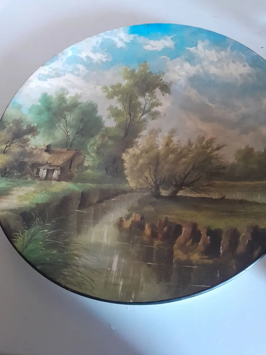 Two handpainted porcelain chargers - Image 1