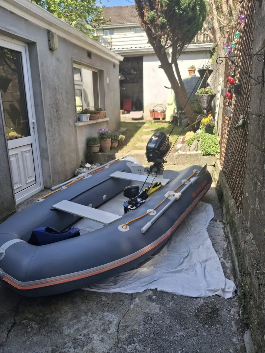 Inflatable boat with engine - Image 1