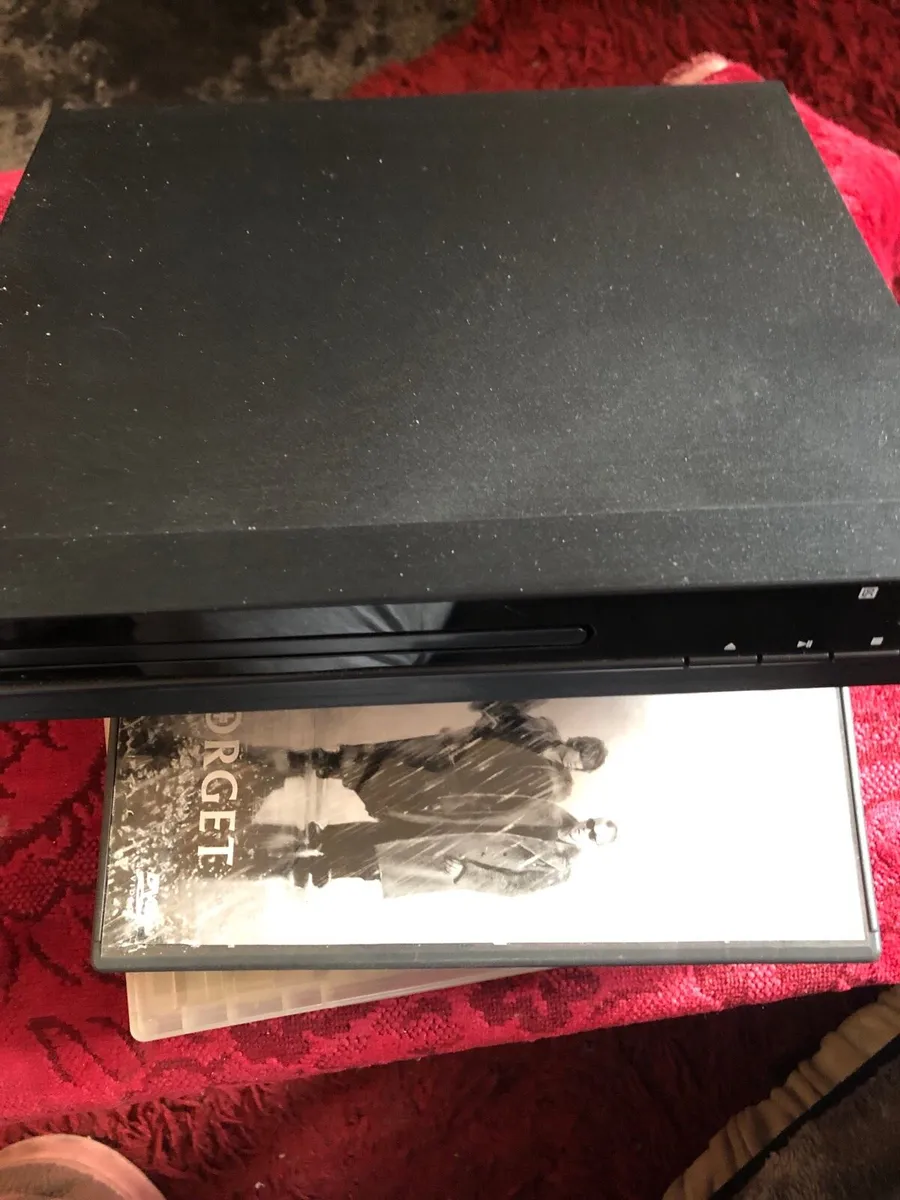 DVD player  and DVDs - Image 1