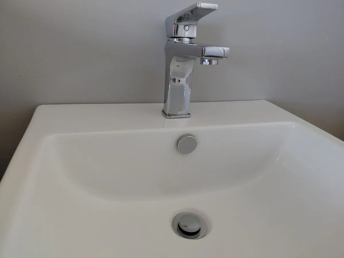 Wall hung bathroom sink with chrome Tap - Image 1