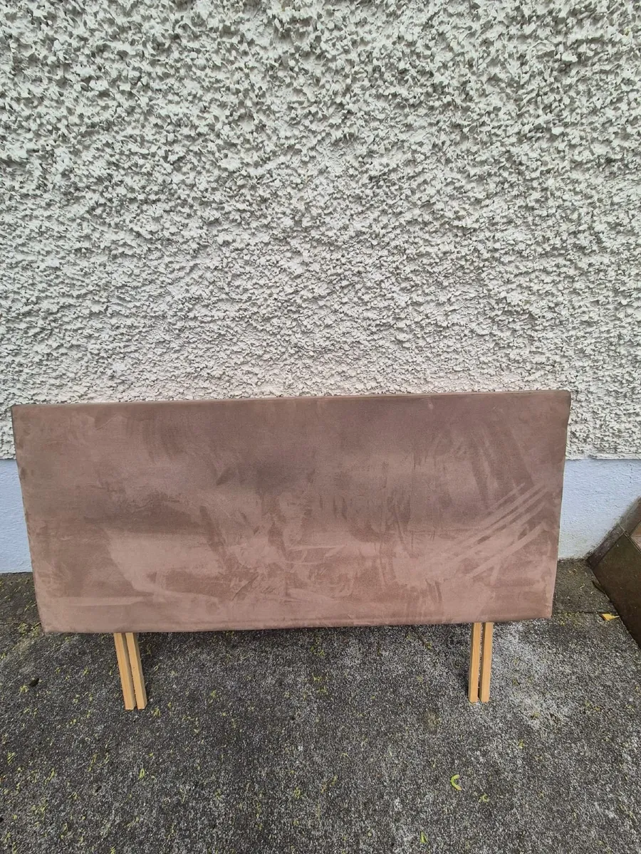 Bed frame with upholstered headboard for sale.