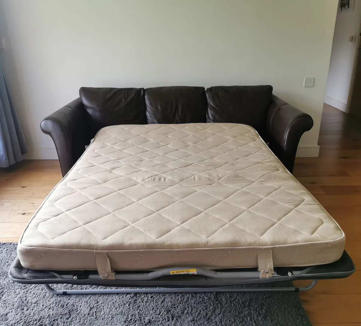 2 Leather couches (1 w/sofabed) & Pouf - Image 3