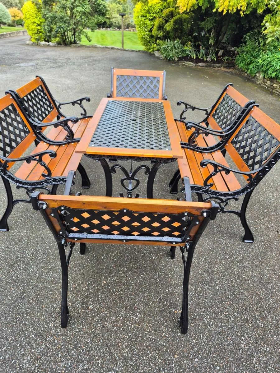 Cast iron table and chairs - Image 1