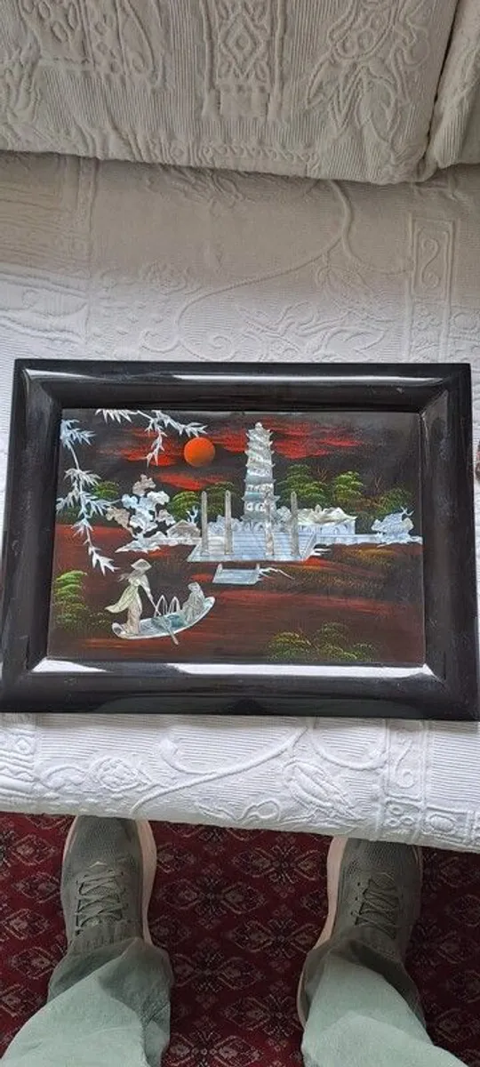 Vintage Vietnamese black lacquer wall plaque featuring intricate mother-of-pearl inlay. - Image 1