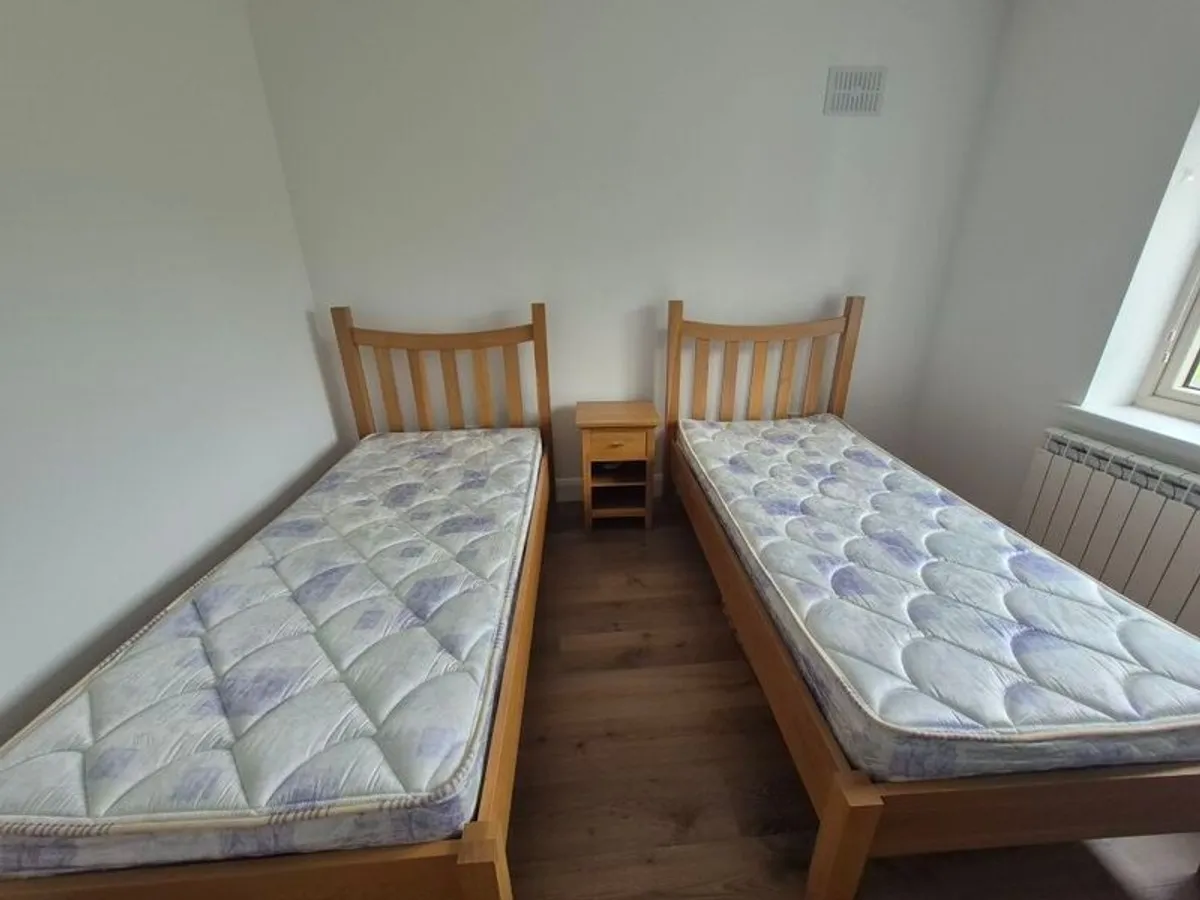 2x Solid Oak Single Beds incl mattress and bedside locker. - Image 1