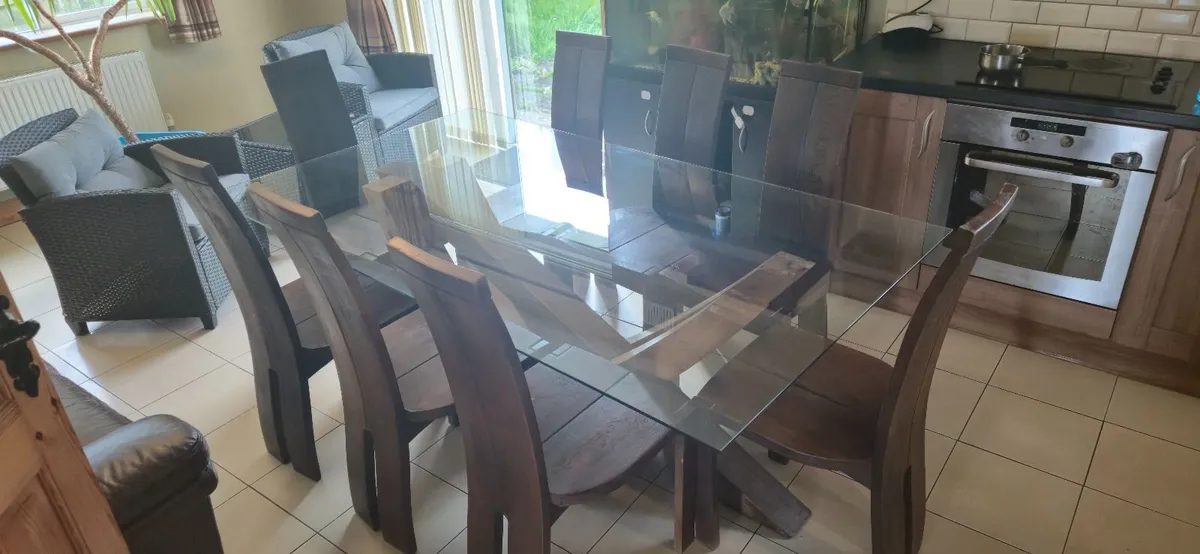 SOLID GLASS TOPPED OAK TABLE WITH 8 OAK CHAIRS - Image 1