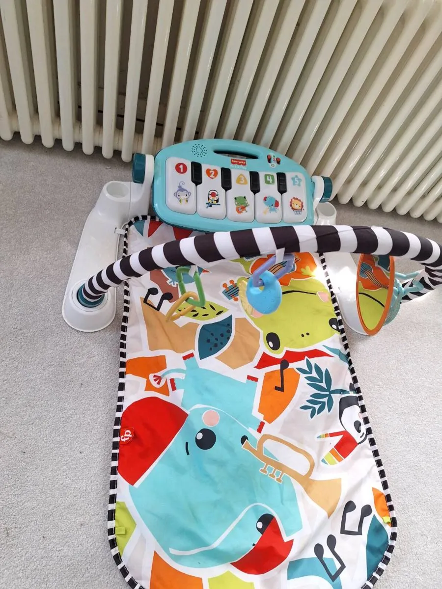 Fisher-Price Glow and Grow Kick & Play Piano Baby