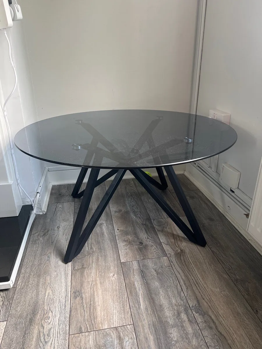 Round smoked glass coffee table – black metal base - Image 2