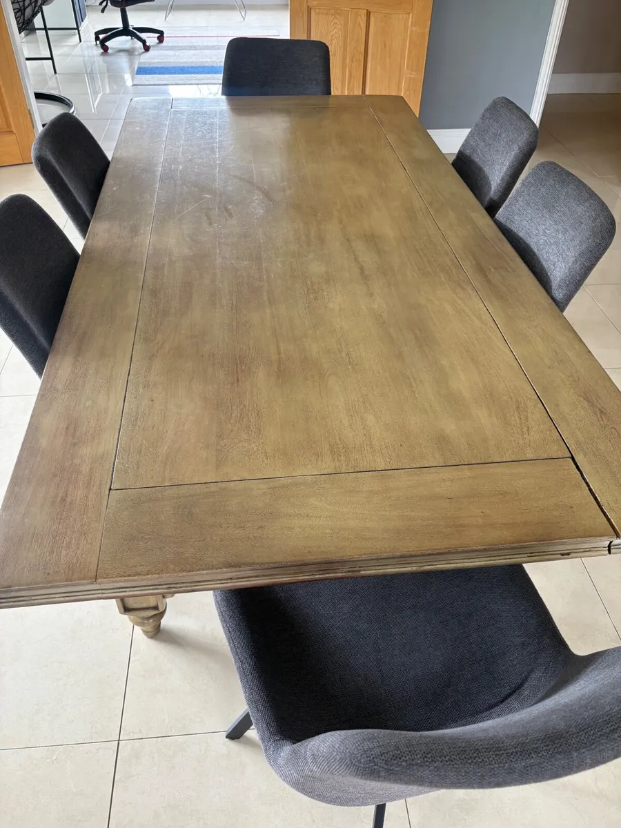 Large wooden table and 6 swivel chairs - Image 1
