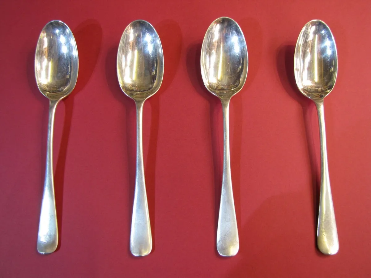 FOUR SOLID STERLING SILVER - SERVING SPOONS. - Image 1