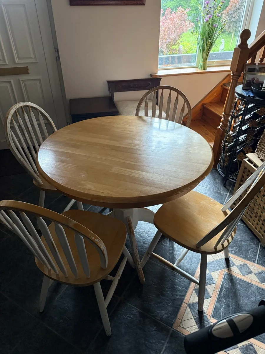 Solid pine table and four chairs.