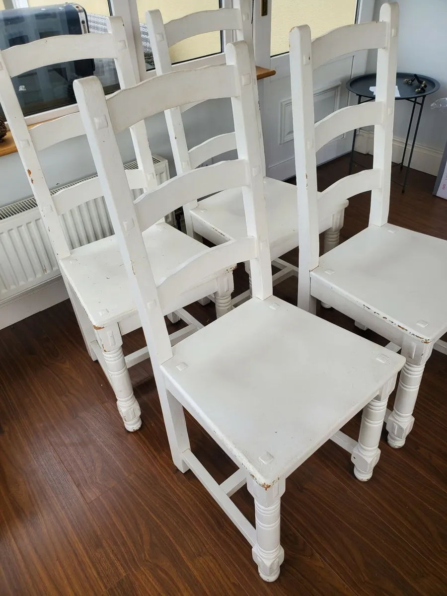 Four solid wood chairs - Image 1