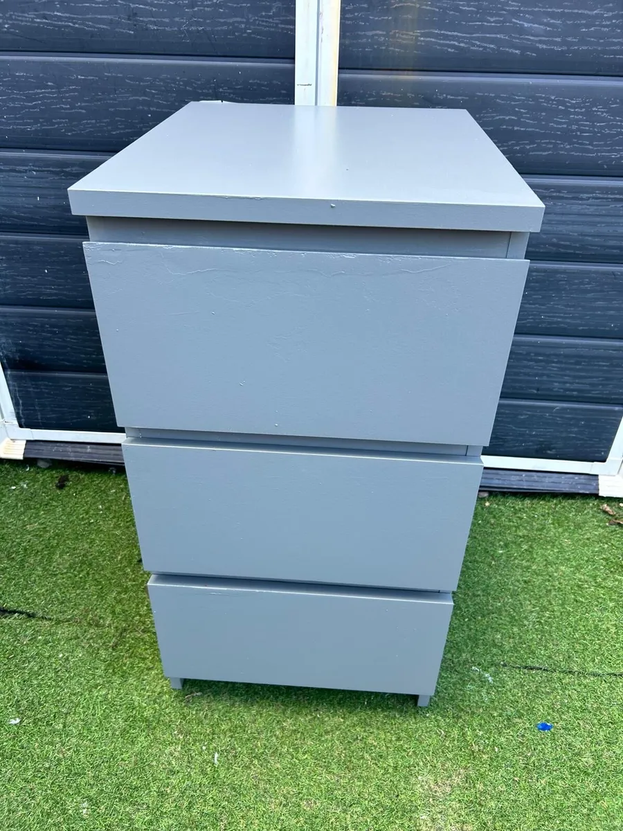 One grey bedside locker