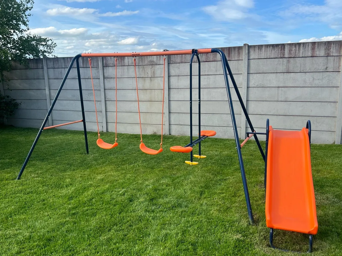 Swing set with slide and seesaw