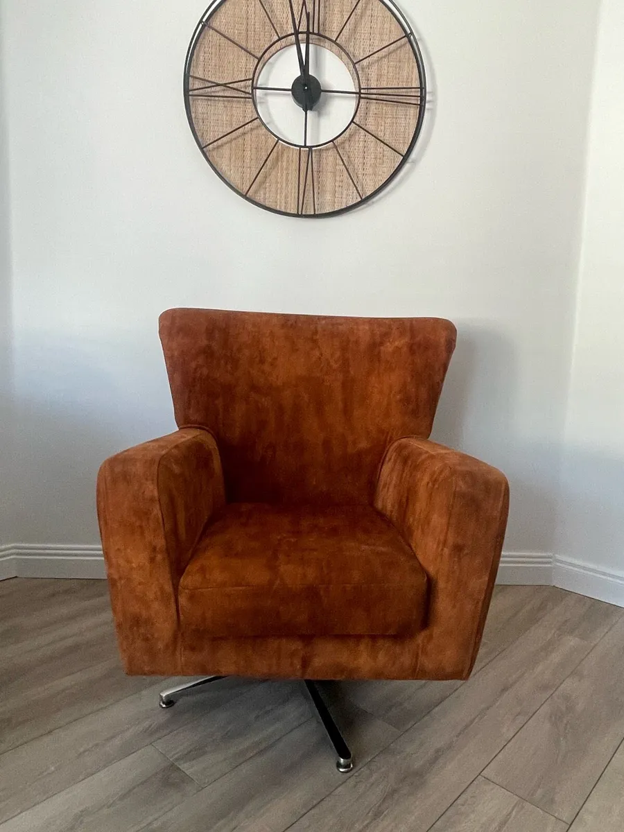 Orange swivel chair - Image 1