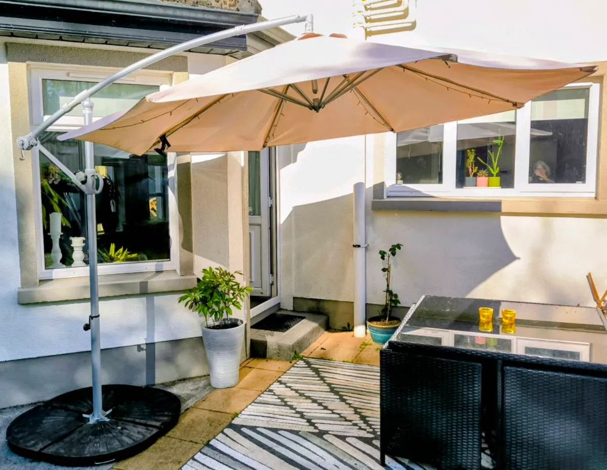 Parasol (Cream) overhanging, stand and weights - Image 1