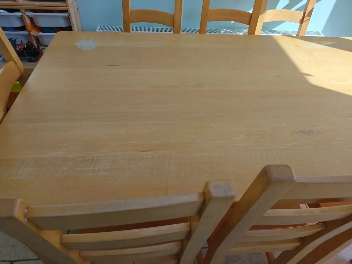 Solid wood table and 8 chairs - Image 1