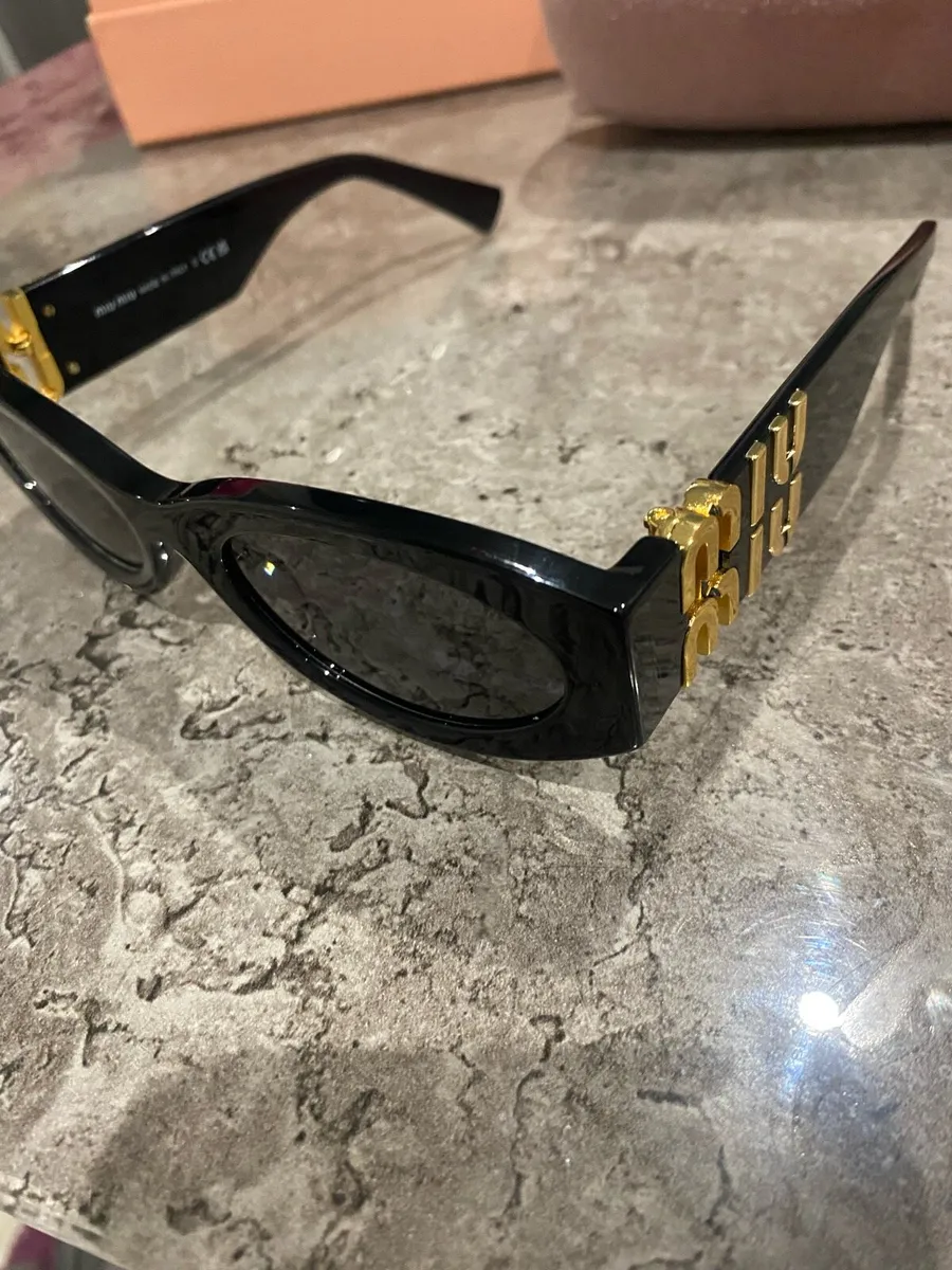 Miu Miu black cat-eye sunglasses - Image 1