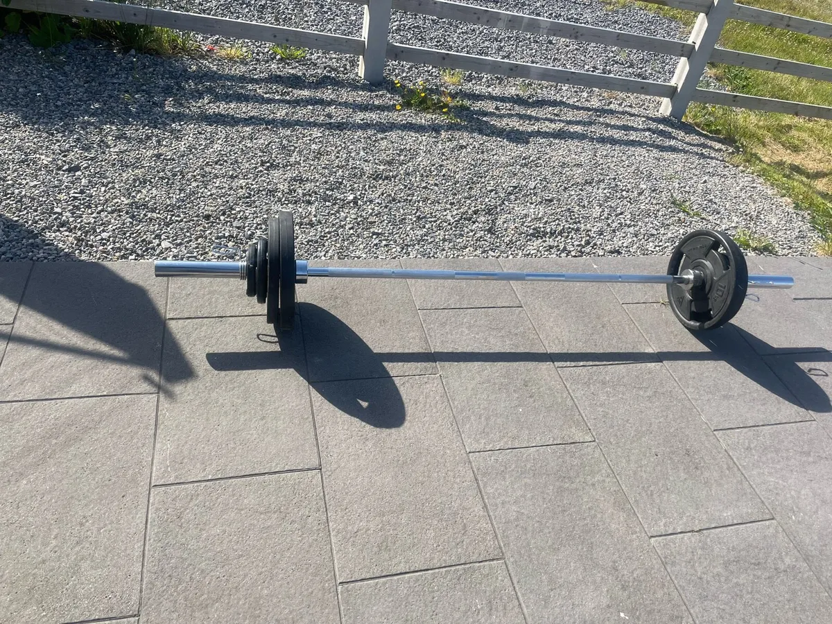 Olympic barbell and rubber plates (60kg total) - Image 1