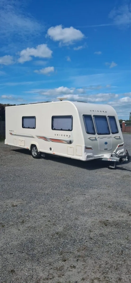 4 BERTH BAILEY UNICORN MADRID TOURING CARAVAN. - Image 1
