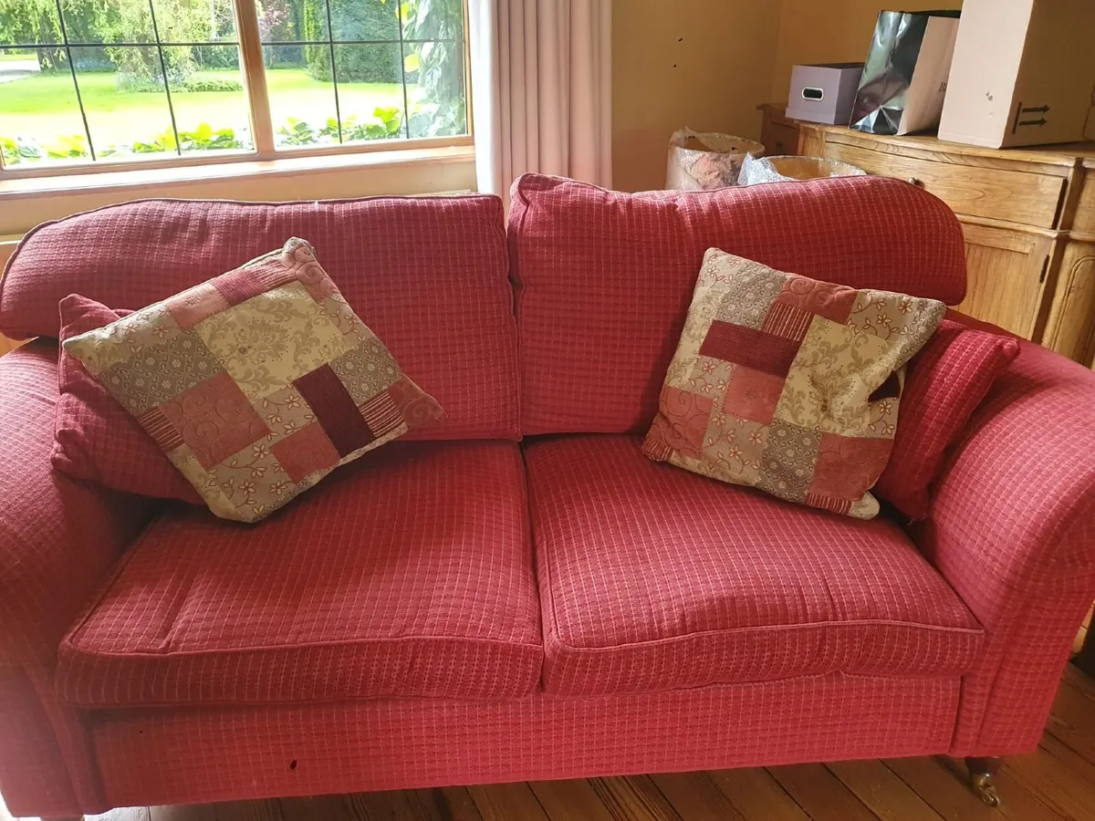 Red Two-Seater Sofa with Patchwork Cushions - Image 1