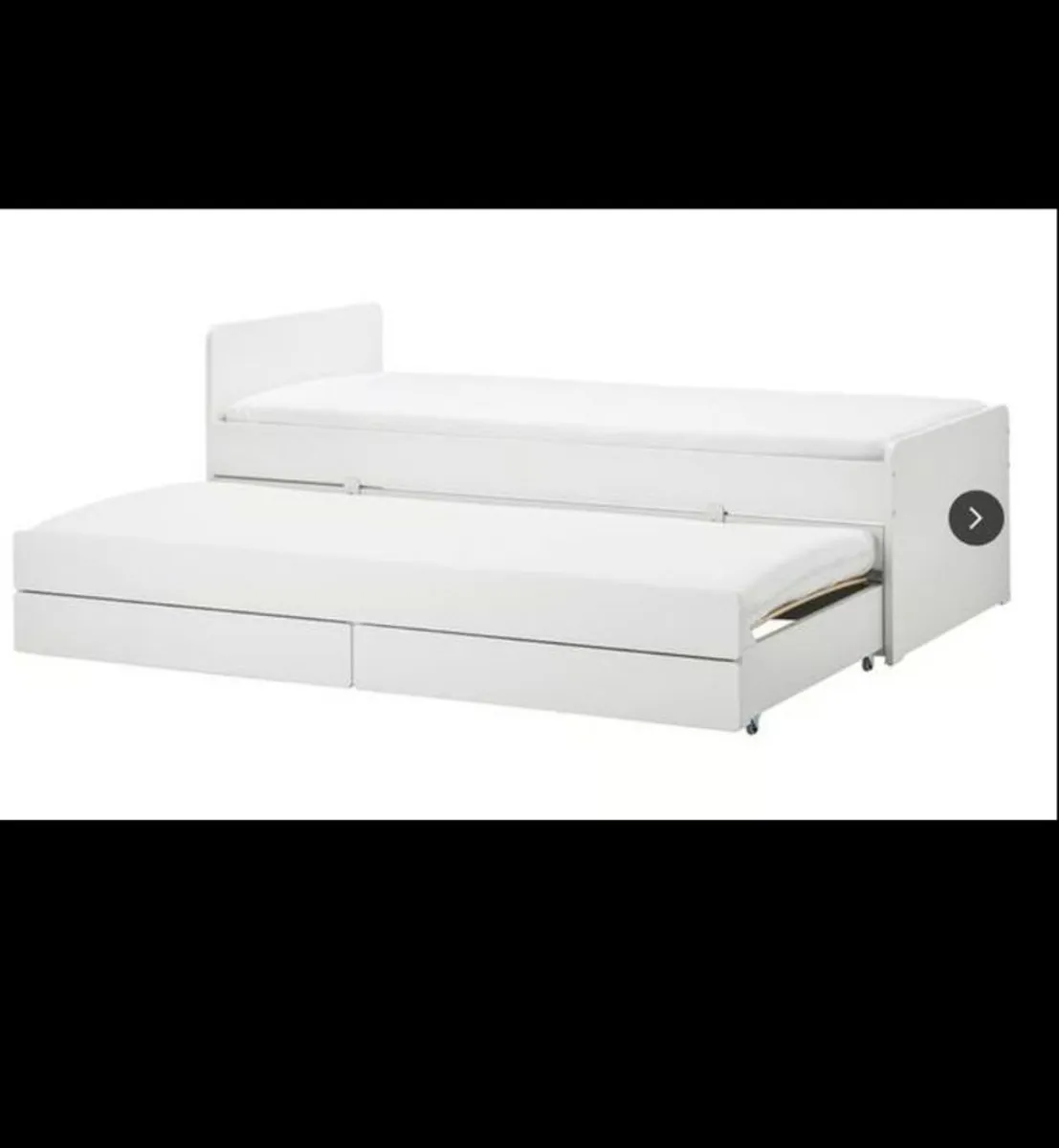 Slakt bed frame with pull out bed and storage - Image 1