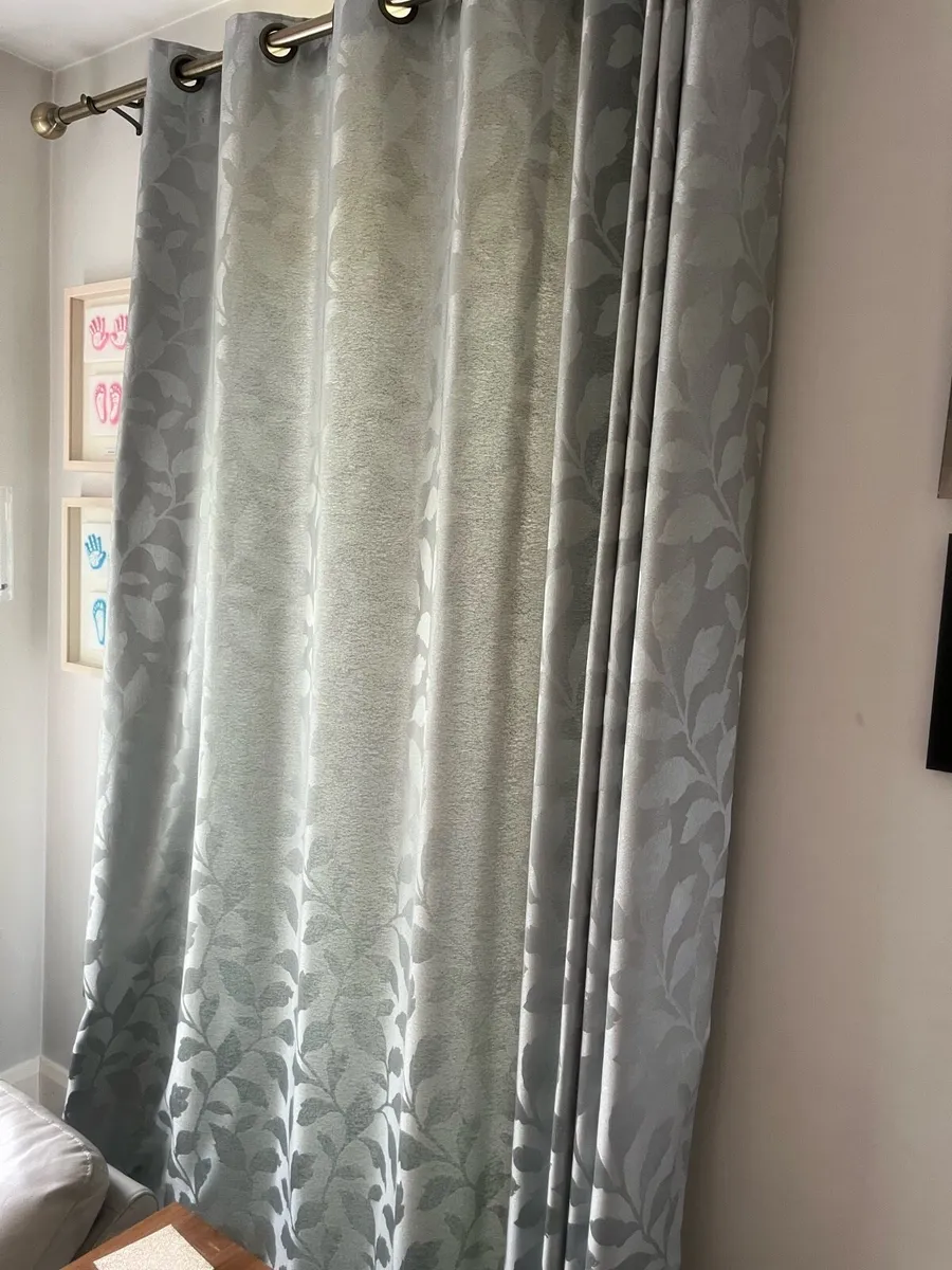 Set of two eyelet curtains and poles - Image 1
